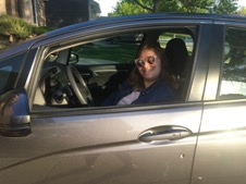 Kate in her car.