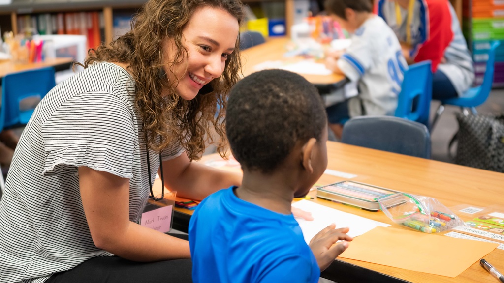 Candidate working with student