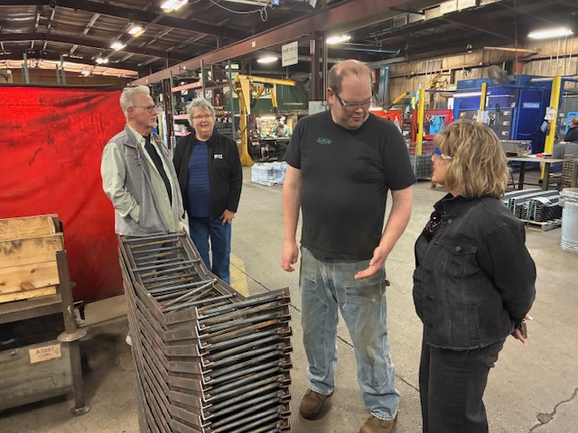 President Wilson talks with Sukups.