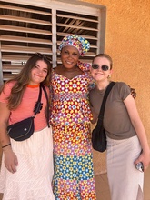 Keenan stands with a Senegalese teacher and a classmate
