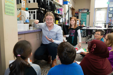 Student performing an experiment for kids