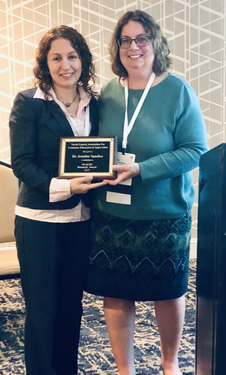 Jennifer Sánchez, assistant professor in Rehabilitation and Counselor Education, receiving the North Central Association for Counselor Education and Supervision's Research Award.