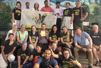 students in Nepal with Hawkeye Teacher banner