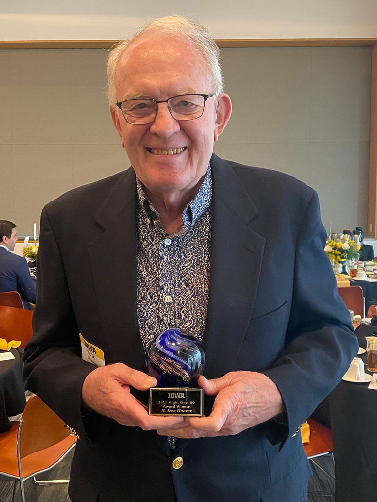 UI College of Education Alumnus H. Dee Hoover holds his Eight Over Eighty award, recognizing him for his continued contributions to the campus and community.