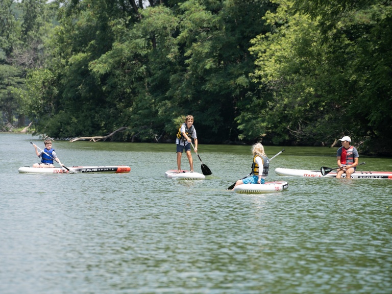 youth campers on paddle boards at the Coralville Lake 