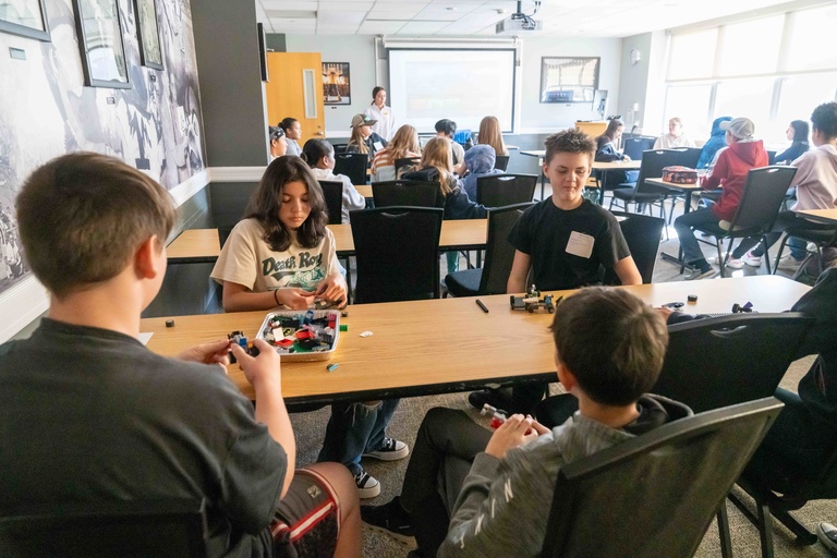 students build houses with lego building blocks