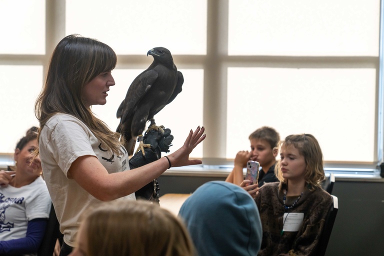 woman holds raptor