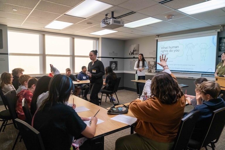 Students spread out around rooms engaging inpresentation