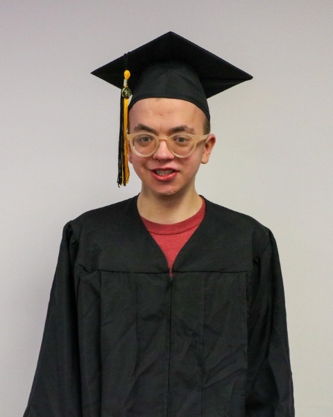 Anthony Andreoli wearing a cap and gown