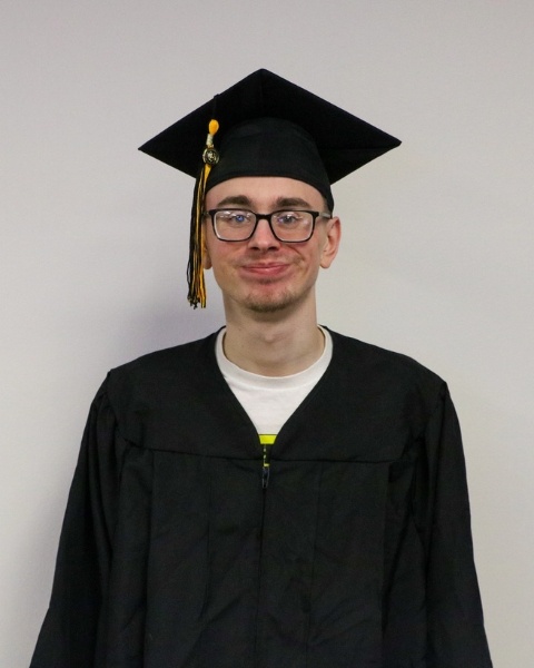 Ben Stangl wearing a cap and gown