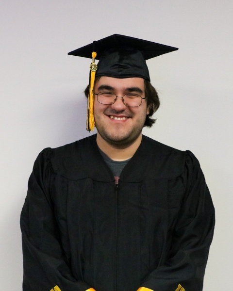 Joe Heinrich wearing a cap and gown