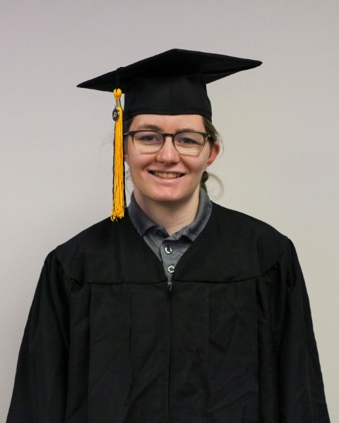 Jordan Cassett wearing a cap and gown