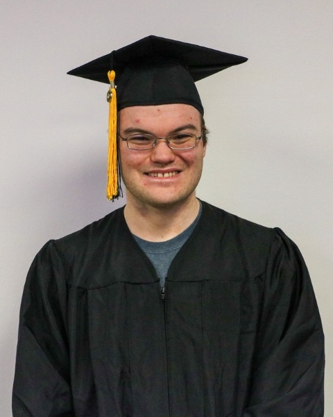 Reece Murray wearing a cap and gown