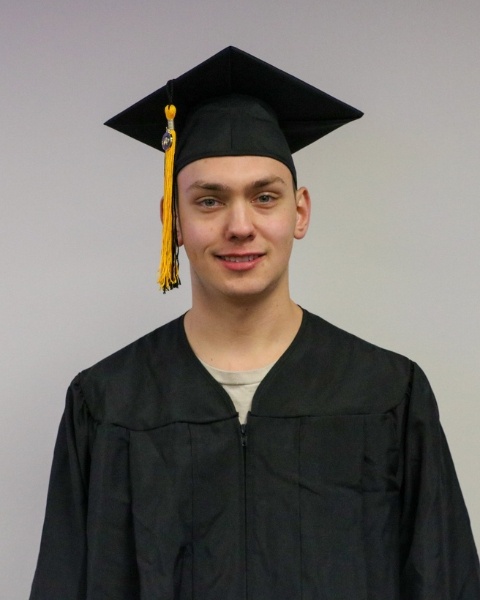 Simon Janelle wearing a cap and gown