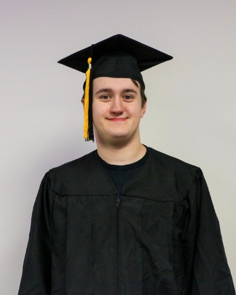 Trever Johnson wearing a cap and gown