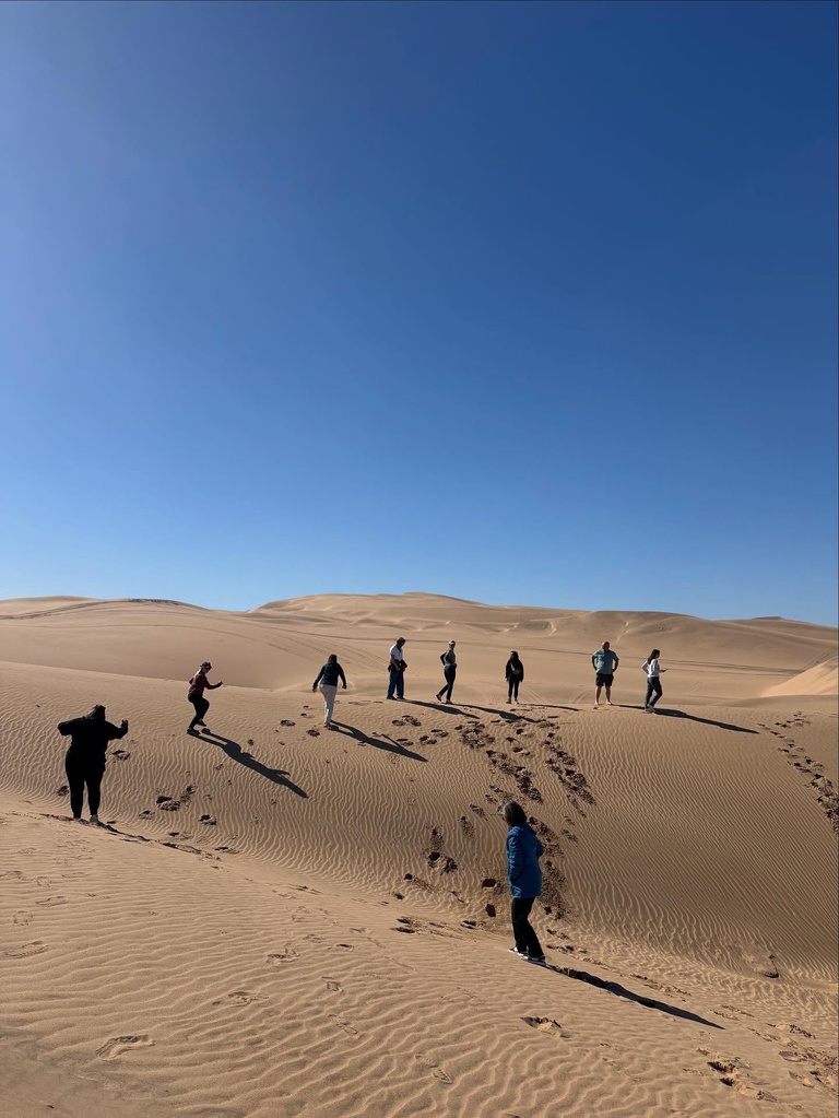 People walking in desert in Namibia