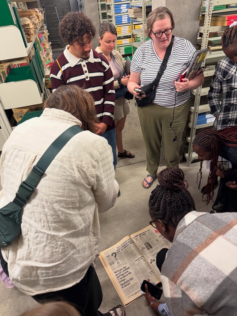 Group of people looking through books
