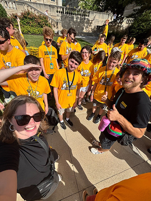 UI REACH RAs and first-year students crowd together during a block party.