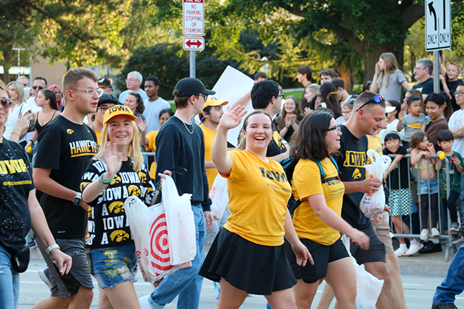 Students walk in the homecoming parade.