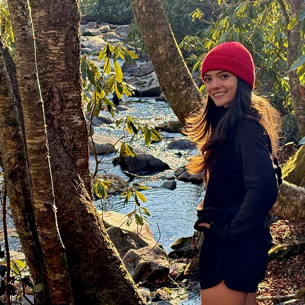 Abigail Cahill in front of a stream