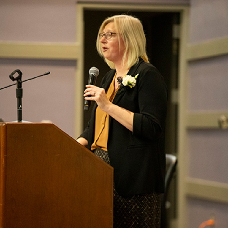 Sara Russell speaking at REACH graduation