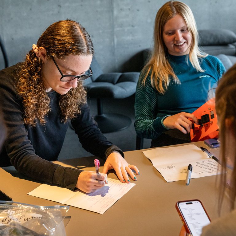 UI students making final calculations before launch.  