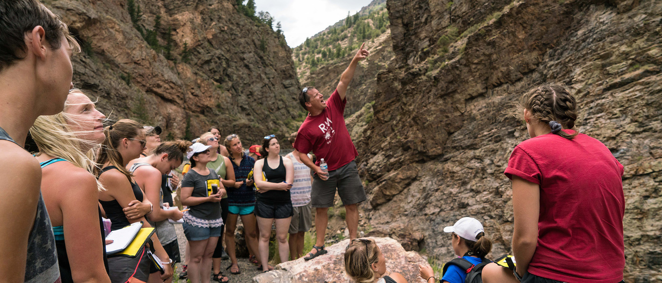 Group of people outside by cliffs