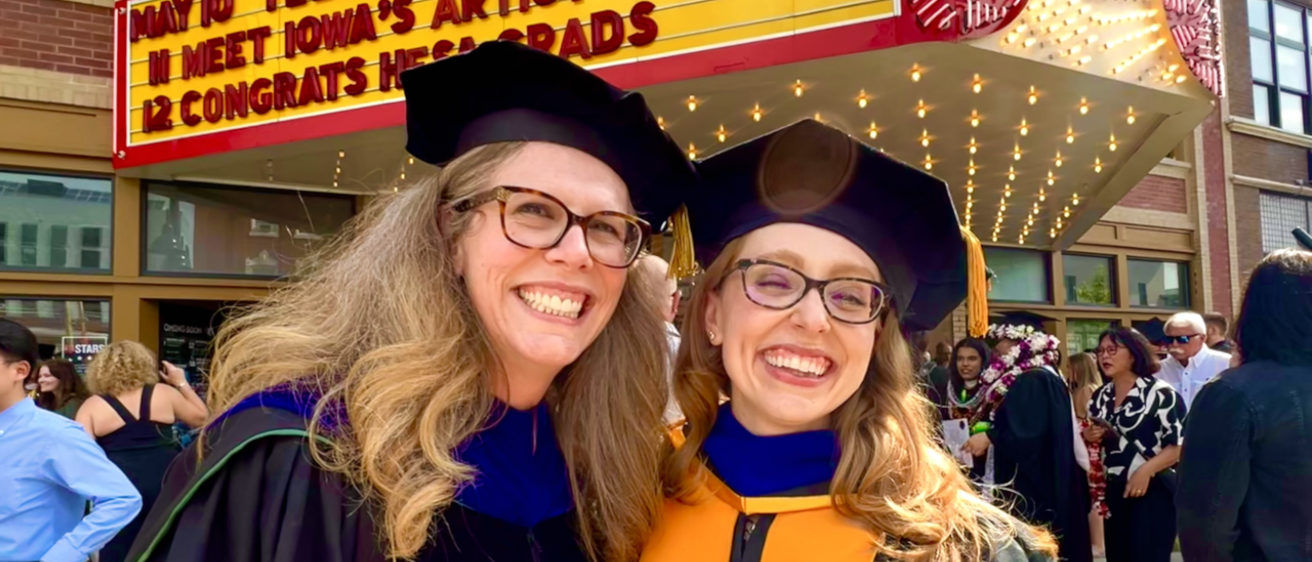 Lauren Irwin poses with Jodi Linley outside The Englert after graduating from her doctorate program.