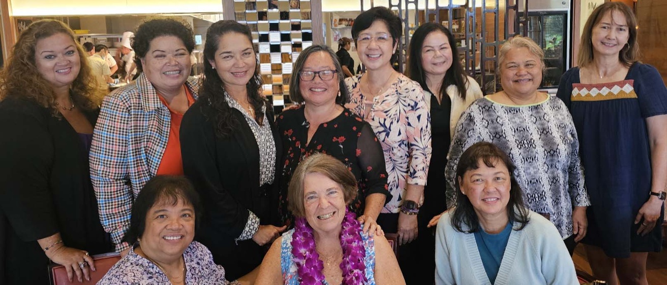 Alumna Cheri Stock with a group of former students gathering for a reunion