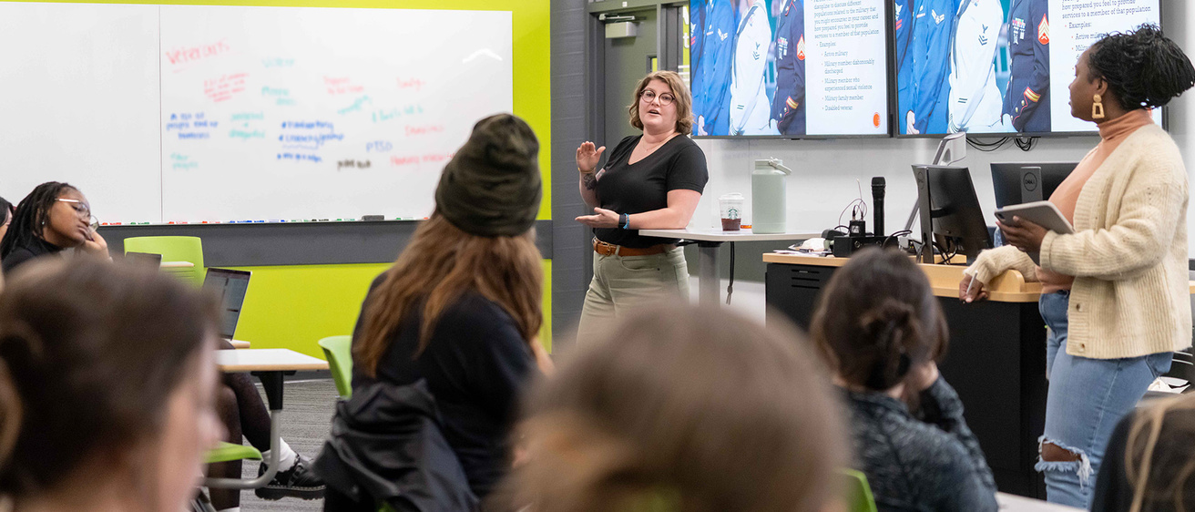 Instructor talking to a class.