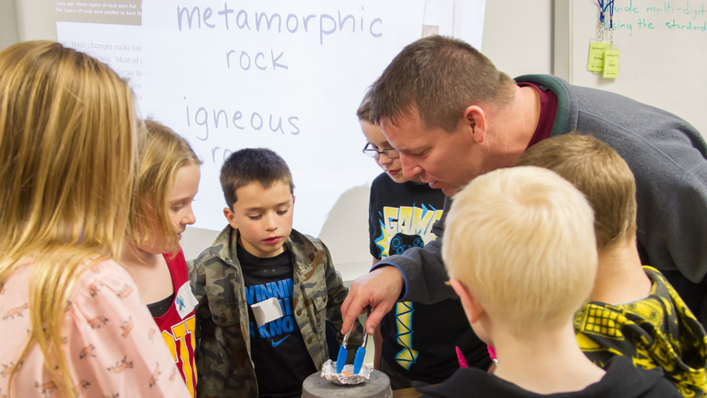 Ted Neil leads a school science night with his science education students.