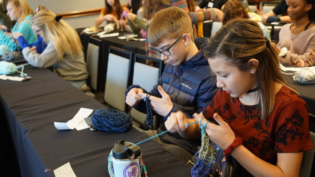 Students working with yarn