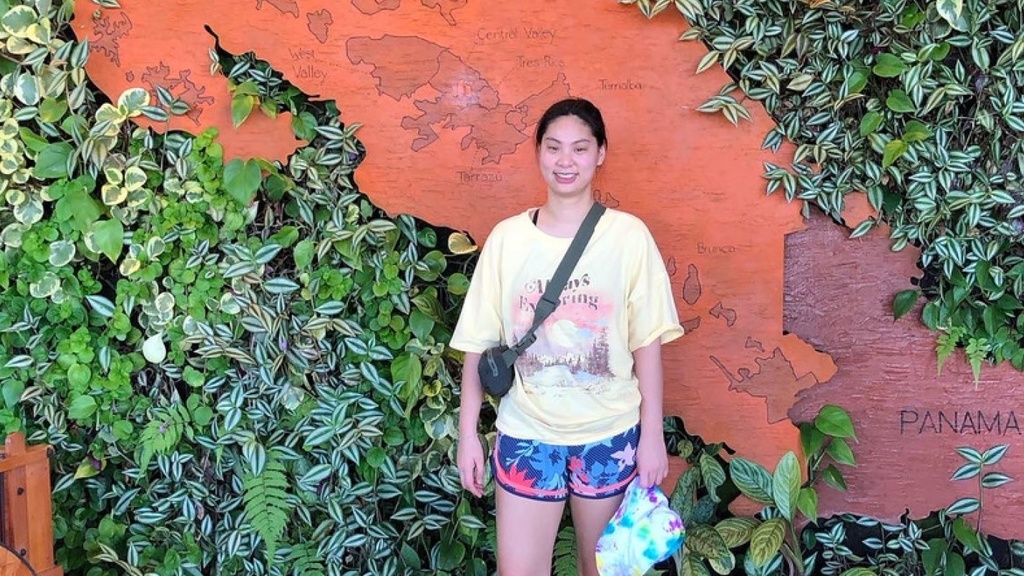 Binh Nguyen in front of a live plant wall with Panama map