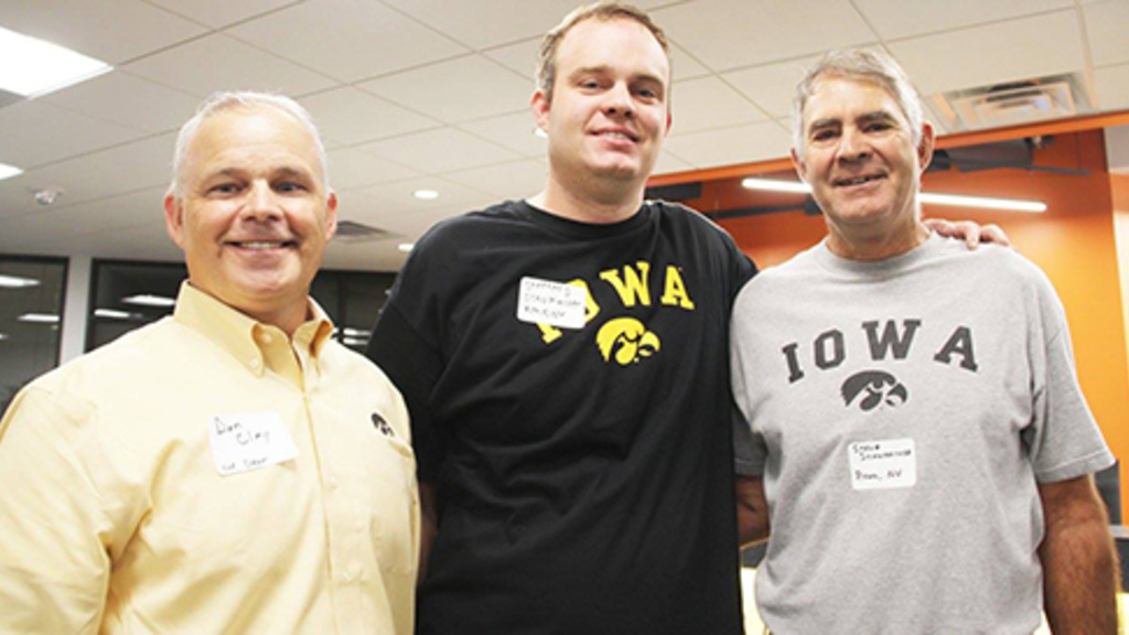 Dean Dan Clay, Stephen Schumacher, and his father Stephen at the college homecoming tailgate