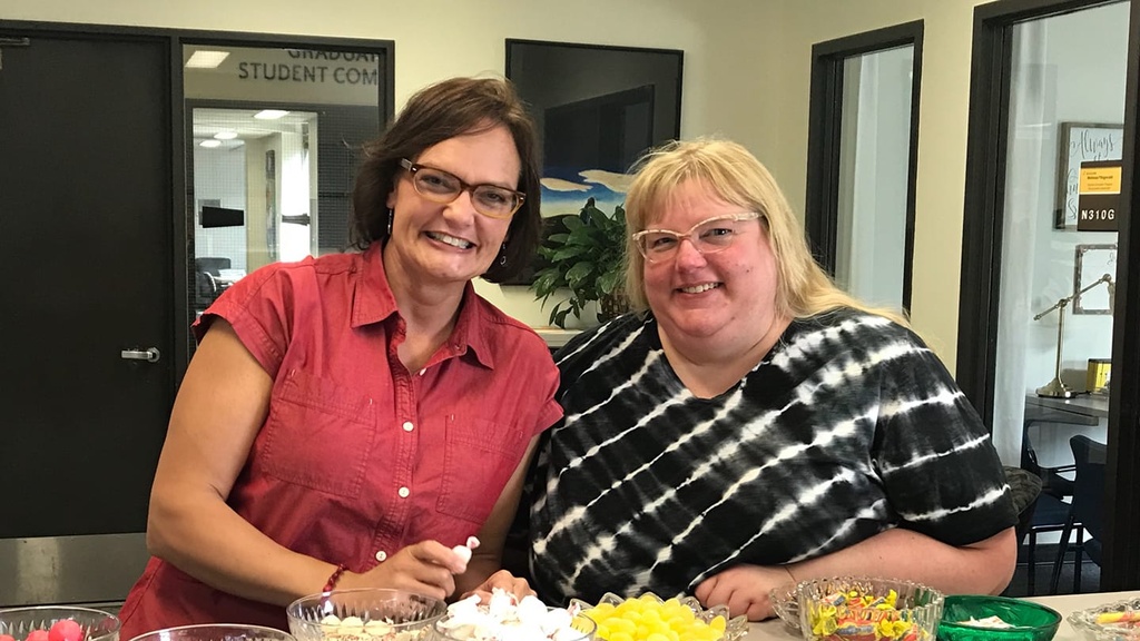 Amy Bennett and Stacy Ervin sit at a counter