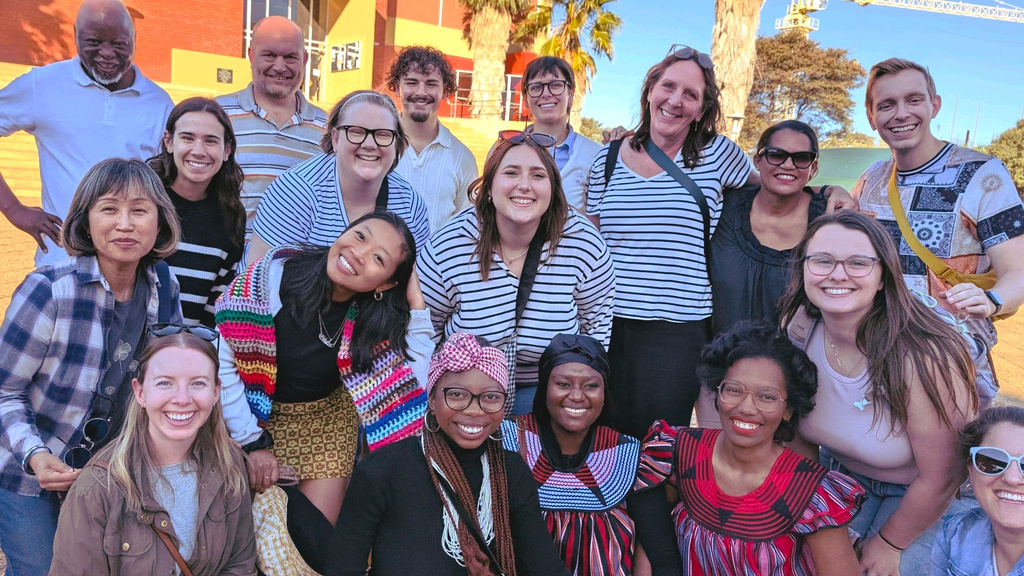 group of people poses towards camera