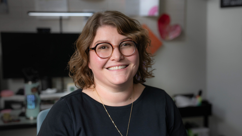 Woman smiles towards camera