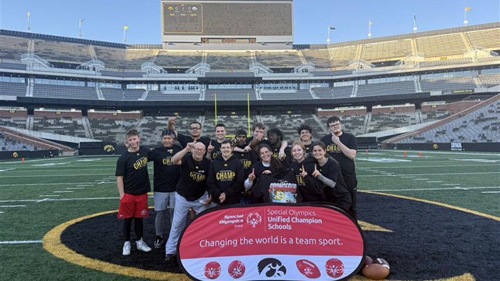 The Unified Flag Football team stands together on the field.