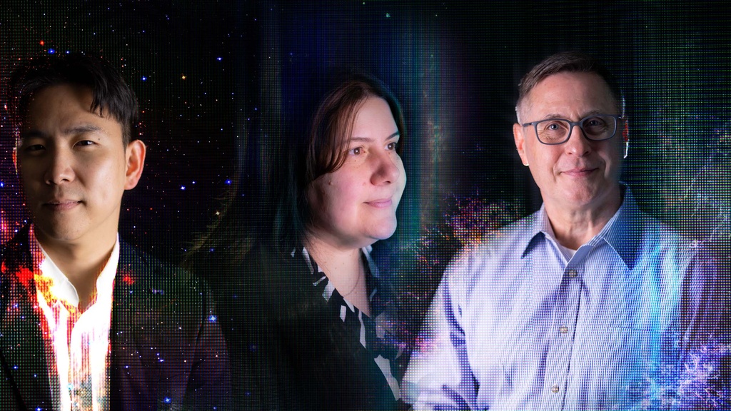 Two men and a woman appear surrounded by cosmic stardust and digital artifacts.